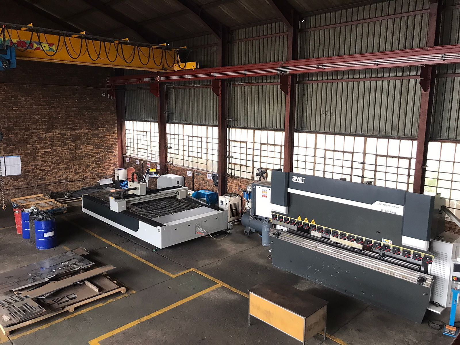 The IK Plus workshop floor in Germiston, with the laser, press brake and overhead crane