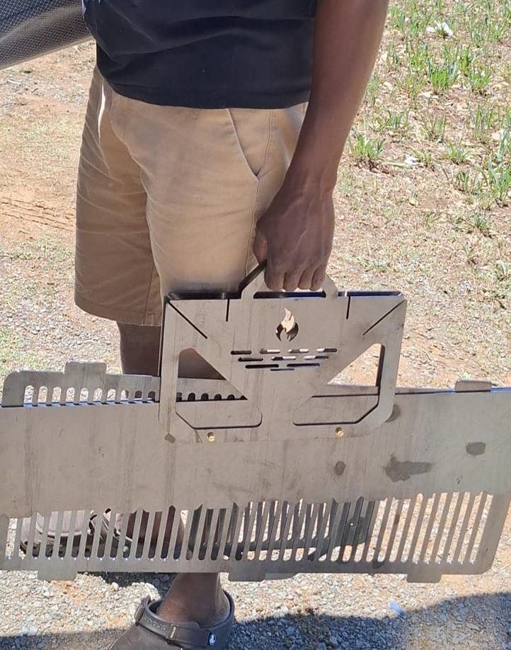 The Kasongo Barbecue Station packed flat and carried by hand