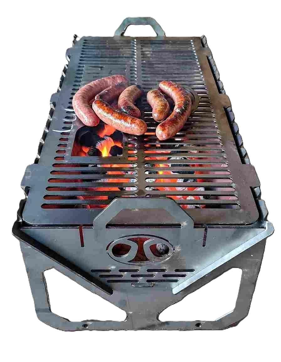 The Kasongo Barbecue Station in use, with boerewors over hot coals