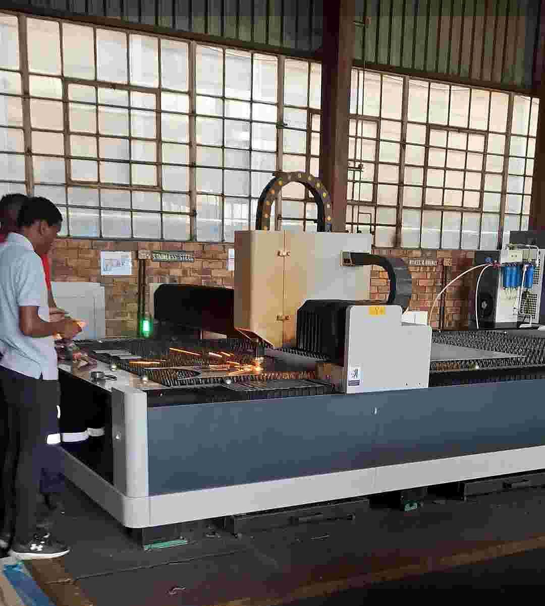 An IK Plus technician at the fibre laser