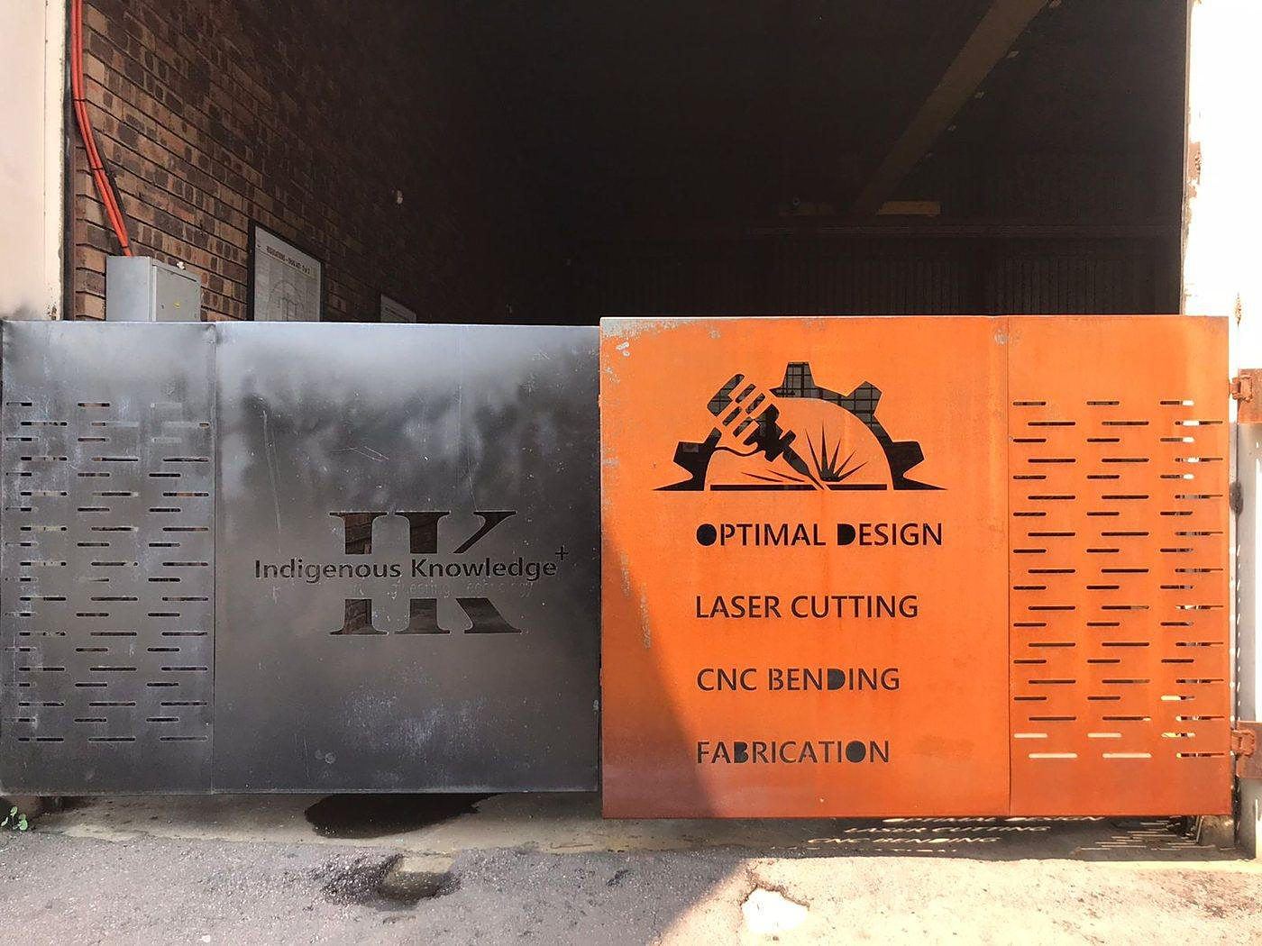 Laser-cut steel signage and perforated panelling installed on site by IK Plus