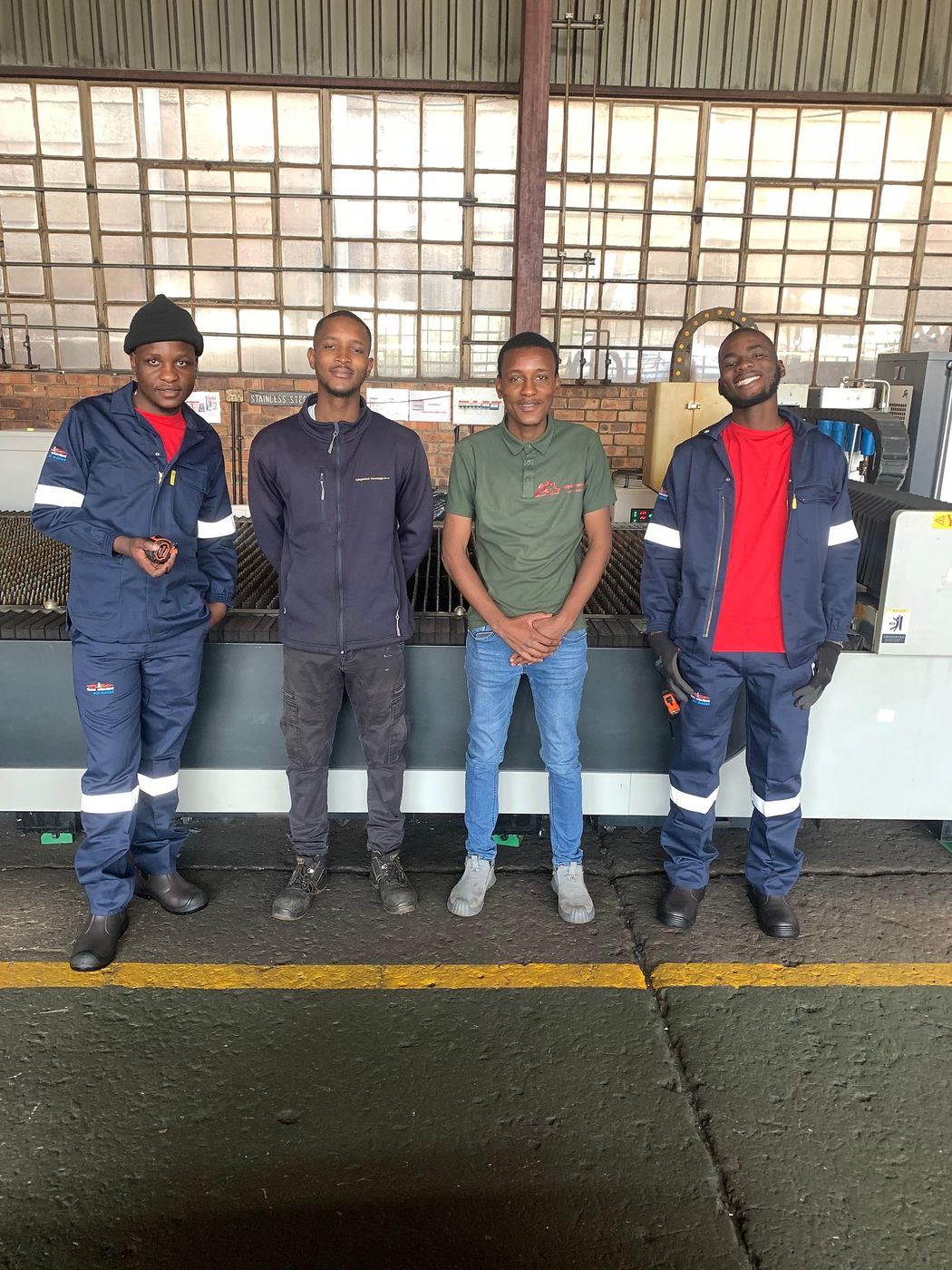 The IK Plus directors and team on the workshop floor in Germiston